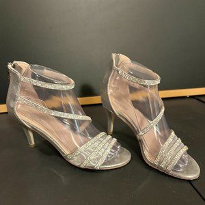 1.5-inch heel, straps covered in white gems.  A charming and fashionable shoe.